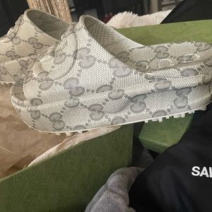 Authentic Gucci slides. Worn once.,these slides are going to be around forever.